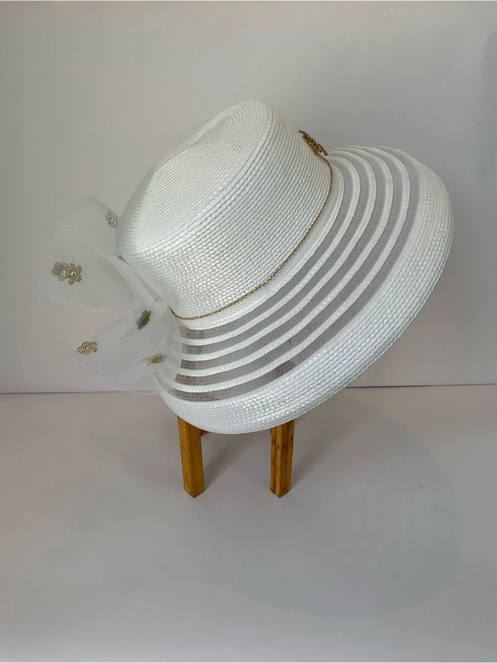 Elegant White Wide-Brim Church Hat with Net Lace Bow and Gold Floral Accent